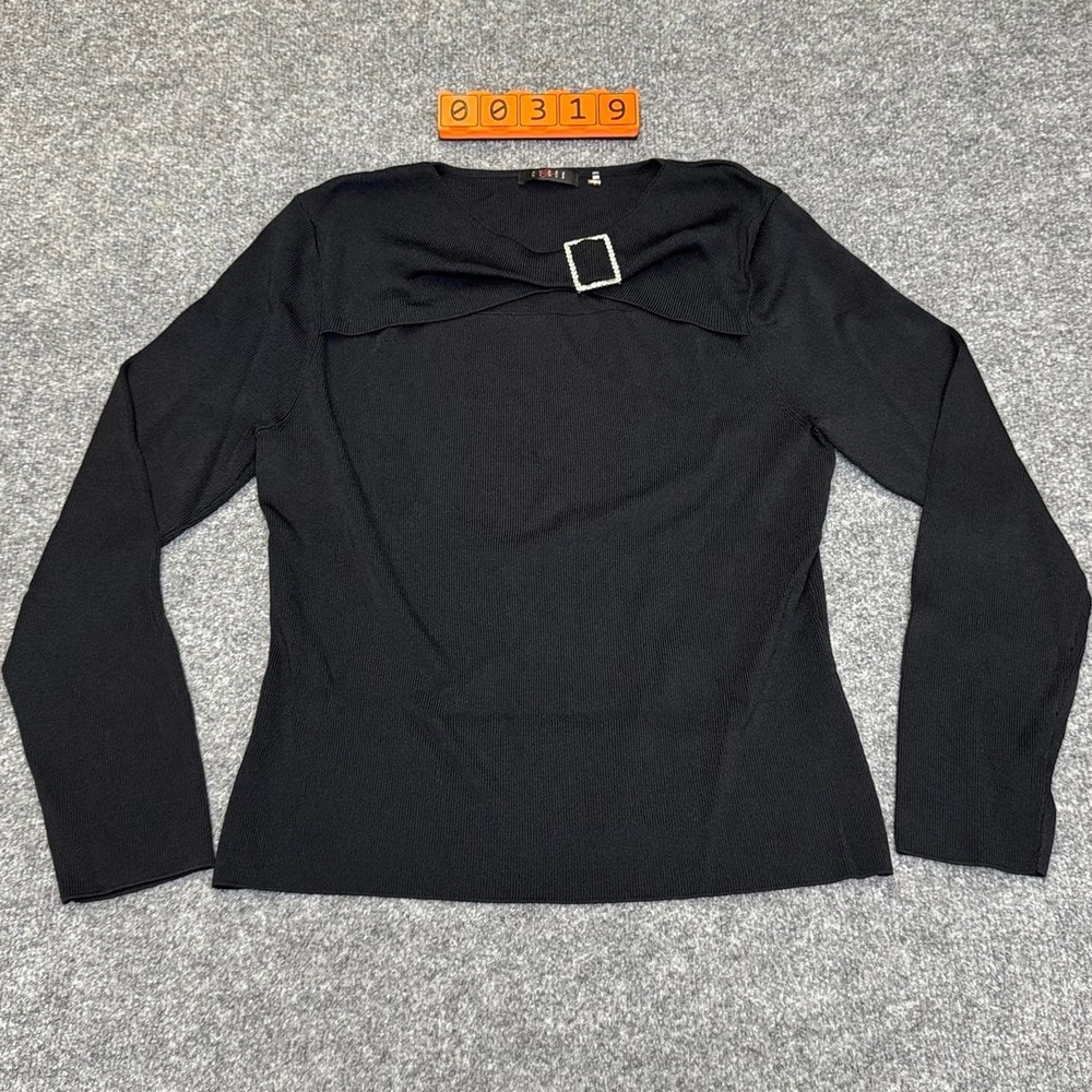 Cyrus Black long sleeve top with cut out and rhinestone buckle detail.